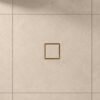 Neston Brushed Brass Square Tile Insert Grate In Tiled Floor Brushed brass square tile insert grate set flush into a large-format tiled floor