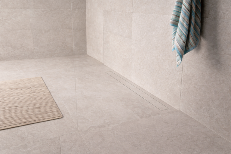 Linear tile insert drain in a zero-threshold shower